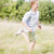 Young boy running in a field smiling stock photo © monkey_business