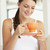 Young Woman Drinking Out Of An Orange Cup stock photo © monkey_business