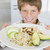 Boy holding plate of food stock photo © monkey_business