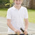 Young boy with racket on tennis court smiling stock photo © monkey_business