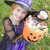 Young girl outdoors in witch costume on Halloween holding candy stock photo © monkey_business