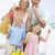 Family standing at beach with ice cream smiling stock photo © monkey_business