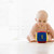 Baby sitting indoors with block stock photo © monkey_business