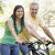 Man and girl on bikes outdoors smiling stock photo © monkey_business