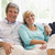 Couple relaxing in living room smiling stock photo © monkey_business