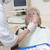 Dentist in exam room with woman in chair stock photo © monkey_business