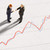 Figurines Of Two Businessmen Shaking Hands On A Line Graph stock photo © monkey_business