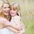 Mother holding daughter outdoors smiling stock photo © monkey_business
