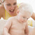 Mother giving baby bubble bath smiling stock photo © monkey_business
