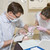 Dentist and assistant in exam room with woman in chair stock photo © monkey_business