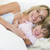 Woman and young girl in bed smiling stock photo © monkey_business