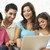 Family Sitting On Sofa At Home With Laptop stock photo © monkey_business