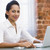 Businesswoman in office with laptop smiling stock photo © monkey_business