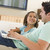 Man with young girl in living room with laptop smiling stock photo © monkey_business