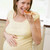 Pregnant woman in kitchen eating French fries and pizza smiling stock photo © monkey_business