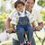 Man and young boy on a bike outdoors smiling stock photo © monkey_business