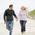 couple · courir · plage · mains · tenant · souriant · homme - photo stock © monkey_business