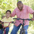 grand-père · petit-fils · vélos · extérieur · souriant · enfant - photo stock © monkey_business