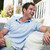 Man sitting on patio with coffee laughing stock photo © monkey_business