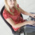 kobieta · interesu · posiedzenia · biuro · wpisując · laptop · uśmiechnięty - zdjęcia stock © monkey_business
