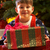 Young Boy Opening Christmas Present In Front Of Tree stock photo © monkey_business
