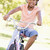 fiatal · lány · bicikli · kint · mosolyog · gyerekek · gyermek - stock fotó © monkey_business