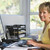 Woman in home office using computer smiling stock photo © monkey_business