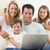 Family in living room with laptop smiling stock photo © monkey_business