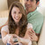 Couple in living room with remote control smiling stock photo © monkey_business