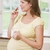 Pregnant woman standing in kitchen with coffee and cigarette stock photo © monkey_business