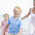 Family running on beach smiling stock photo © monkey_business