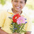 Young boy holding flowers and smiling stock photo © monkey_business