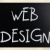 'Web design' handwritten with white chalk on a blackboard stock photo © nenovbrothers