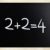 '2+2=4' handwritten with white chalk on a blackboard stock photo © nenovbrothers