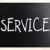 'Service' handwritten with white chalk on a blackboard stock photo © nenovbrothers