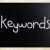 The word 'Keywords' handwritten with white chalk on a blackboard stock photo © nenovbrothers