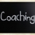 'Coaching' handwritten with white chalk on a blackboard stock photo © nenovbrothers