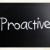 The word 'Proactive' handwritten with white chalk on a blackboar stock photo © nenovbrothers
