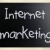 'Internet marketing' handwritten with white chalk on a blackboar stock photo © nenovbrothers