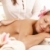 Smiling woman enjoying back massage stock photo © nyul