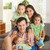 portré · boldog · család · három · gyerekek · otthon · ölelkezés - stock fotó © nyul