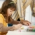 Schoolgirl painting in art class at elementary school stock photo © nyul