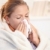 Young woman having flu blowing her nose stock photo © nyul