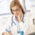 Young female doctor working at desk stock photo © nyul