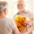 улыбаясь · старший · человека · цветы · старший · женщину - Сток-фото © nyul