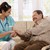 счастливым · медсестры · пожилого · пациент · , · держась · за · руки · сидят - Сток-фото © nyul