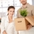 Happy couple unpacking boxes in new home stock photo © nyul