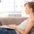 Young woman using laptop at home stock photo © nyul