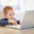 Little businessman using laptop at home  stock photo © nyul