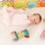 mirando · colorido · juguete · cama · mano - foto stock © nyul